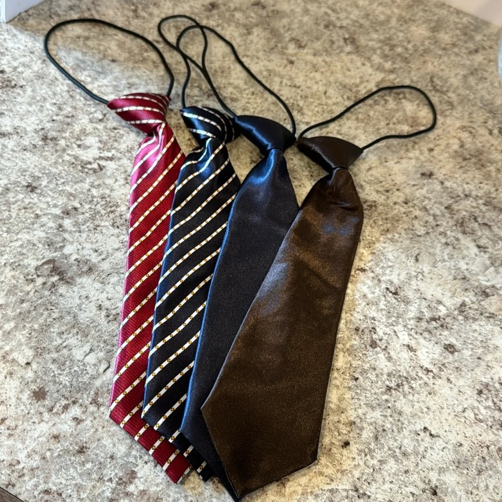 unisex Tie set of 4. Attached elastic cord goes under the collar 1 NWOT